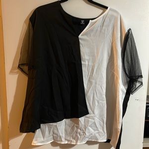 Color block black and white top with sheer black shirt sleeves. NWT